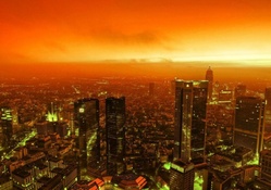 city under fiery sky