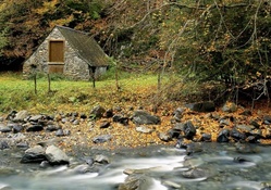 lovely stone cabin by a flowing river