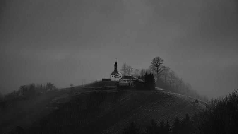 magical rural hilltop church in grayscale