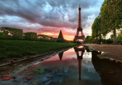 eiffel tower reflected in a puddle hdr