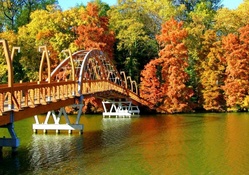 beautiful bridge over river in autumn
