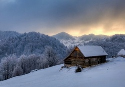 wooden mountain cabin in winter hdr