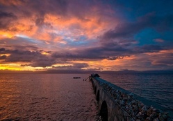 wonderful old stone pier at sunset