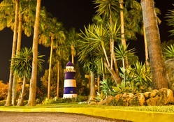 lovely lighthouse among palm trees