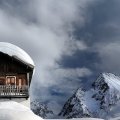 snow covered chalet up high in the mountains