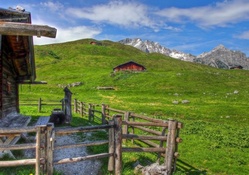 wooden cabins on the mountains in summer