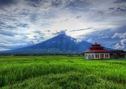 lovely temple in the fields by a volcano