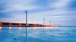 coastal turbine windmills at dusk