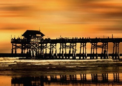 lovely fishing pier at sunset