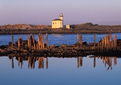 lighthouse on the low rocks coast