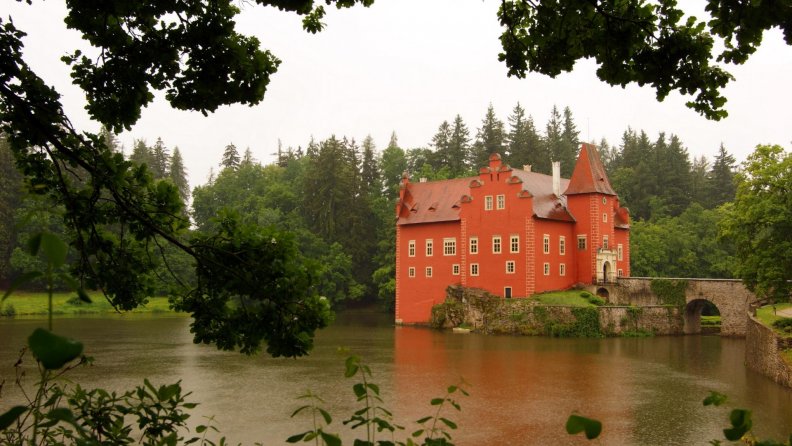 beautiful castle on a lake in rain