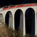 train on a high bridge in the mountains