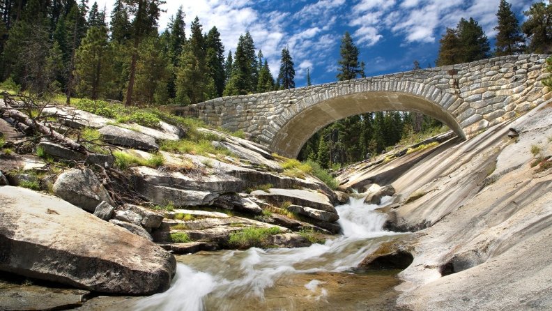 wonderful stone bridge over mountain stream