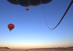 Hot Air Balloons Take Off at Sunrise Namib Desert Namibia.