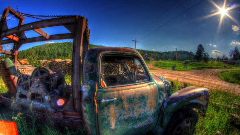 abandoned truck by the side of a farm road hdr