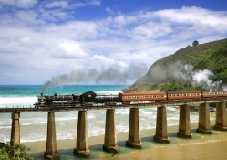 locomotive train crossing bridge