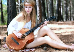 Erica Playing Guitar in a Forest