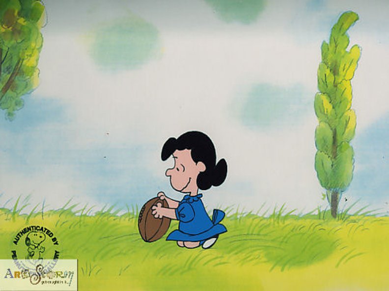 lucy holding pigskin