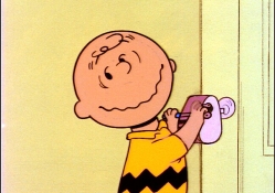 charlie brown looking at red haired girl